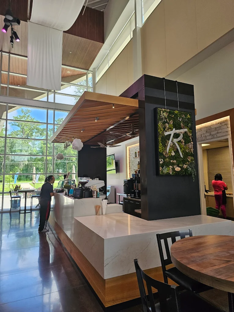 The Mission Café espresso bar under a wood-slat ceiling